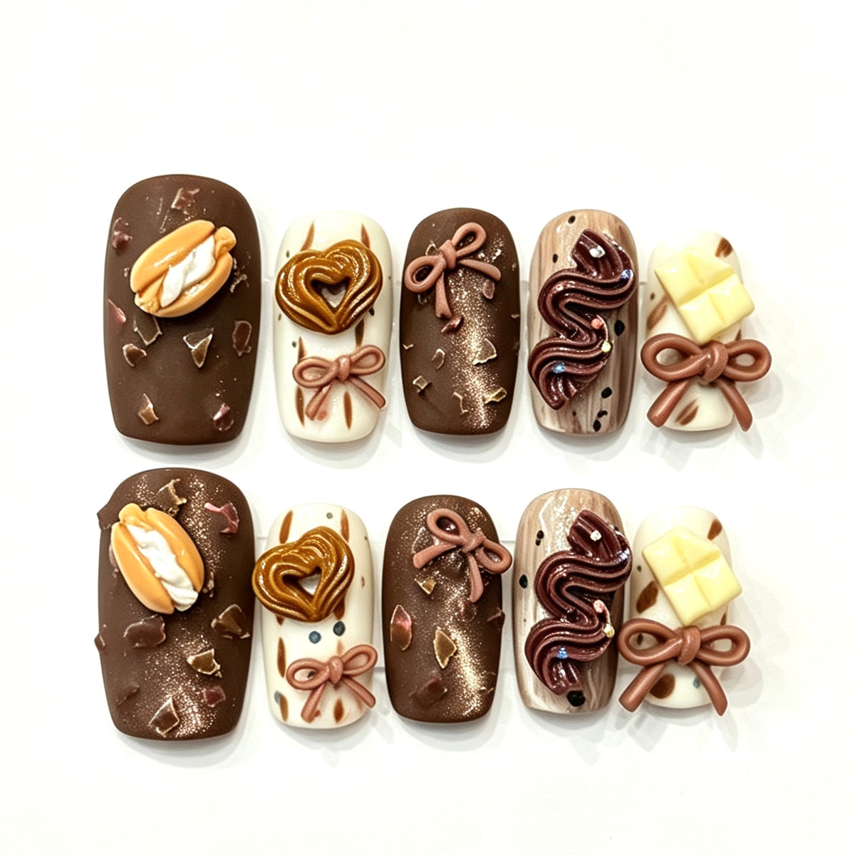 Chocolate and cream press-on nails with sculpted bows and truffle swirls