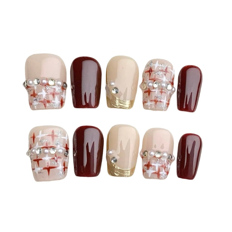 Burgundy and nude press-on nails with red plaid, pearls and gold French tips