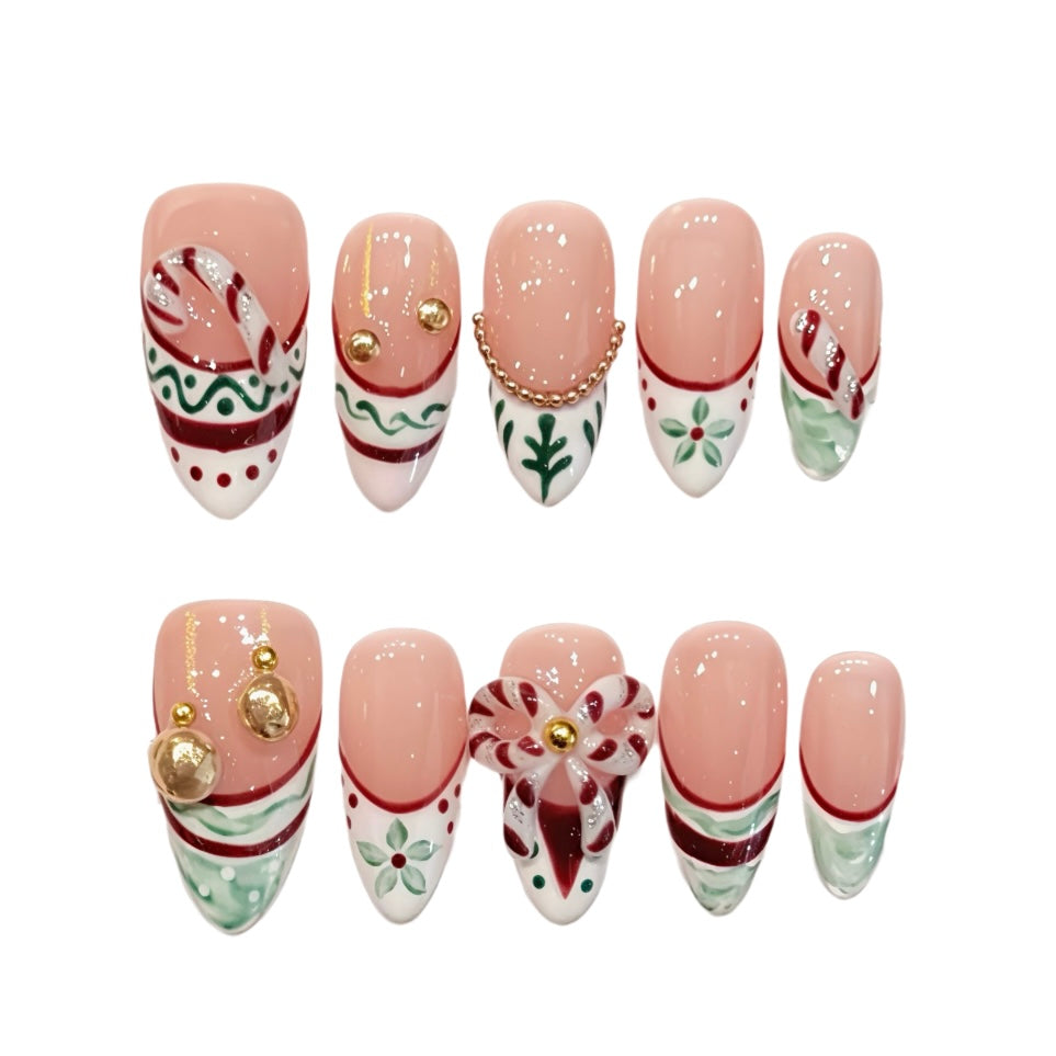 Pink Christmas French tips with candy canes, holly, ornaments and a reindeer