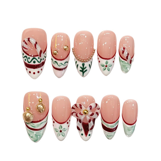 Pink Christmas French tips with candy canes, holly, ornaments and a reindeer