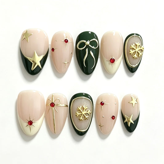 Forest green and ivory Christmas press-on nails with gold stars, snowflakes and bows