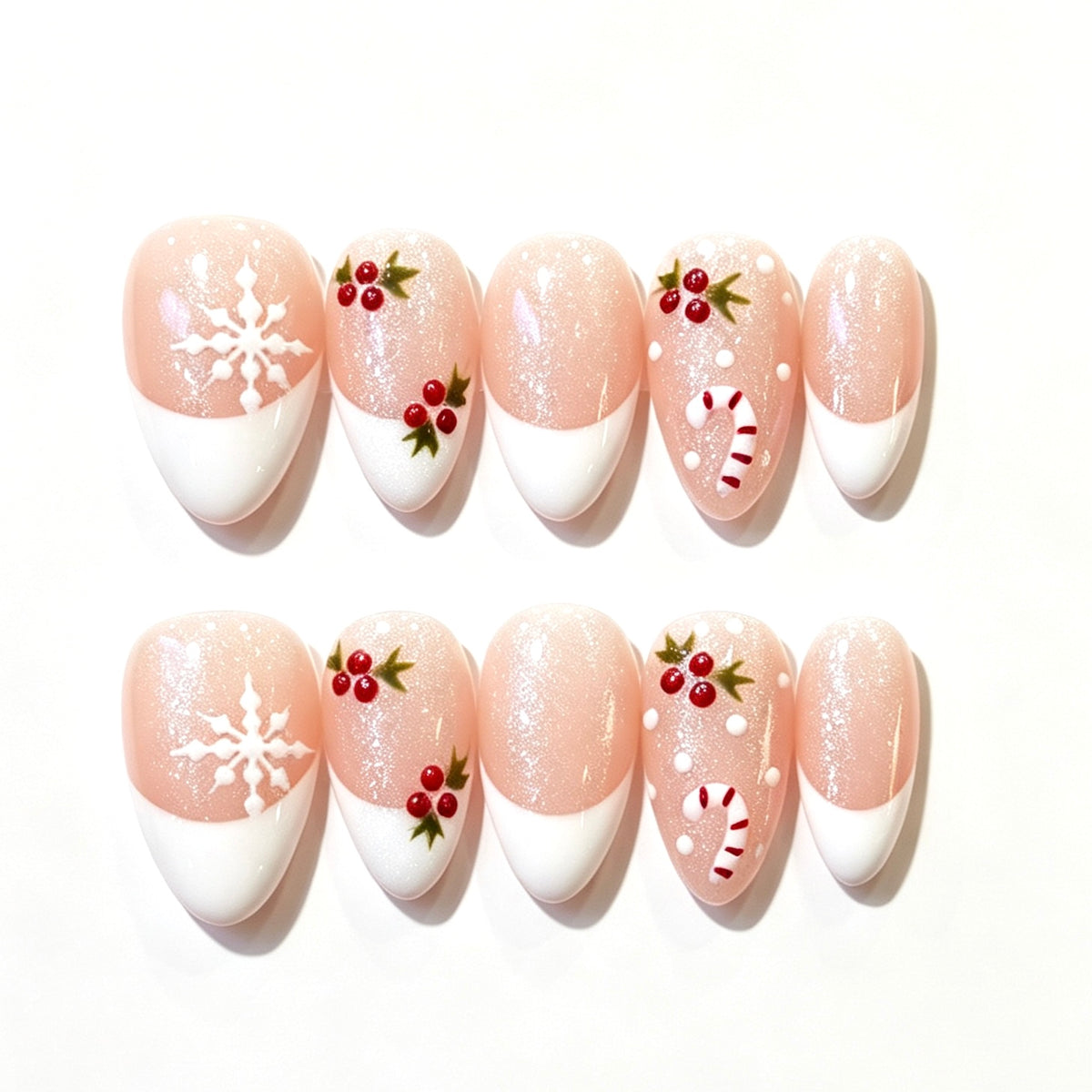 Blush pink French tips with snowflakes, holly berries and candy canes