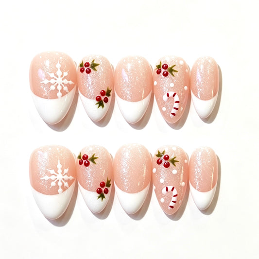 Blush pink French tips with snowflakes, holly berries and candy canes