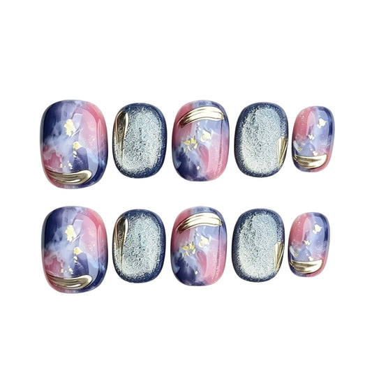 Purple and blue aurora press-on nails with silver cat-eye shimmer and gold curves