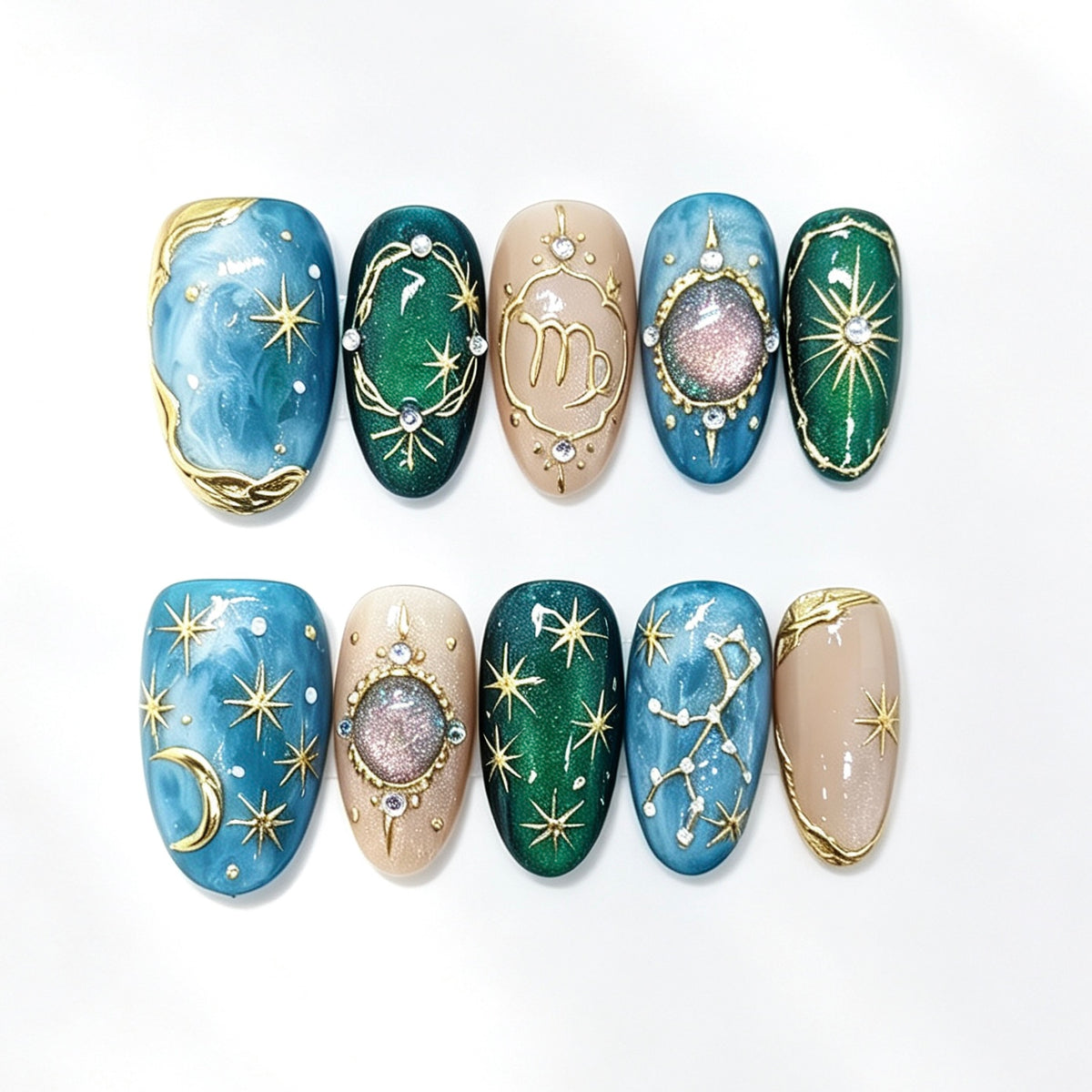 Blue and emerald celestial press-on nails with gold stars, moons and gem details